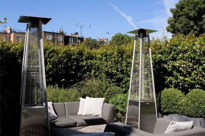Image of two space heaters in a garden.